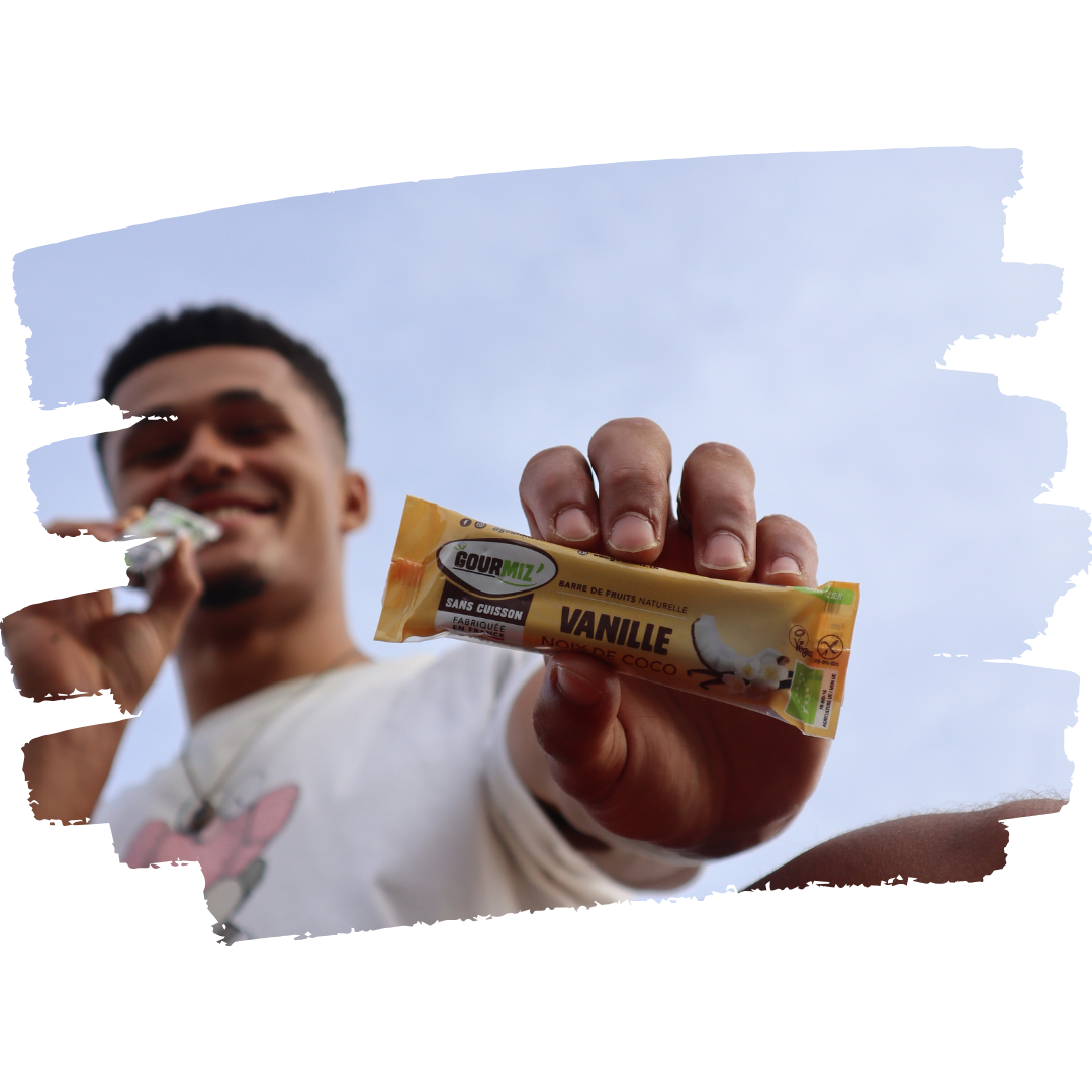 Young man with a Gourmiz' energy bar